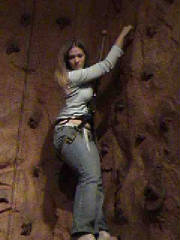 Kimberly repelling down from the wall.