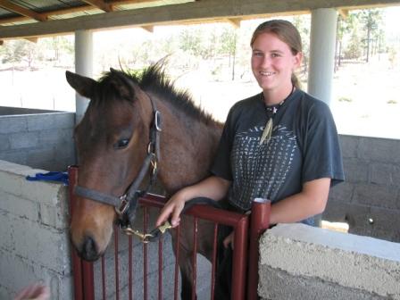 Honduras3308/19_Dina__a_Danish_Volunteer_assigned_to_the_horse_and_dairy_program___the_new_filly.JPG